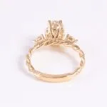 Vintage Twist Band Three-Stone Oval Moissanite Engagement Ring with Pear Cut Accents