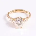 Vintage Twist Band Three-Stone Oval Moissanite Engagement Ring with Pear Cut Accents