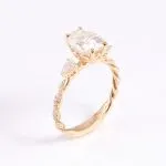 Vintage Twist Band Three-Stone Oval Moissanite Engagement Ring with Pear Cut Accents