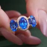 ​​Cobalt Blue Lab Gemstone Ring | 18K Gold Halo Setting with Moissanite Embrace​