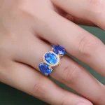 ​​Cobalt Blue Lab Gemstone Ring | 18K Gold Halo Setting with Moissanite Embrace​