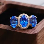 ​​Cobalt Blue Lab Gemstone Ring | 18K Gold Halo Setting with Moissanite Embrace​