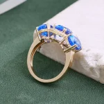 ​​​​Cobalt Blue Lab Gemstone Ring | 18K Gold Halo Setting with Moissanite Embrace​