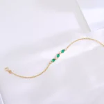 Delicate Oval Emerald and Diamond Station Bracelet in 18k Yellow Gold