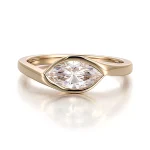 Elegant Marquise Cut Moissanite Solitaire Ring Featuring A Protective Modern Bezel Setting