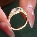 Elegant Marquise Cut Moissanite Solitaire Ring Featuring A Protective Modern Bezel Setting