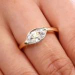 Elegant Marquise Cut Moissanite Solitaire Ring Featuring A Protective Modern Bezel Setting